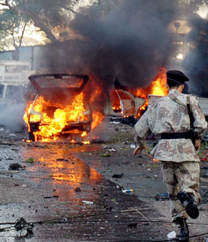 Bombing near U.S. consulate kills four, including U.S. diplomat, ahead of Bush visit to Pakistan