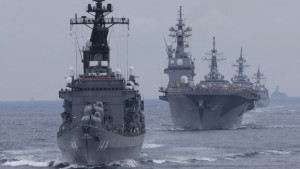 Japan Maritime Self-Defense Force (JMSDF) escort ship "Kurama" leads other vessels during a fleet review in water off Sagami Bay, south of Tokyo, on Sunday, October 14, 2012. (AP Photo/Itsuo Inouye)