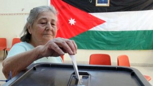 A Jordanian woman casts her ballot at a polling station in Amman in this November 9, 2010, file photo. (KHALIL MAZRAAWI/AFP/Getty Images)