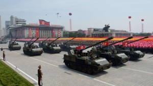 North Korean tanks pass through Kim Il-Sung square during a military parade marking the 60th anniversary of the Korean war armistice in Pyongyang on July 27, 2013. (AFP PHOTO/Ed Jones)