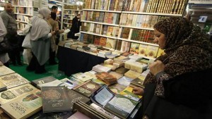 A woman looks at books inside an exhibition hall during the 29th annual meeting of French Muslims organized by The Union of Islamic Organizations of France (UOIF) at Le Bourget, near Paris April 7, 2012. (Reuters/Gonzalo Fuentes)