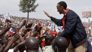 In this August 2, 2010, file photo, President Paul Kagame of Rwanda shakes hands with Rwandans at a rally in Gicumbi, Rwanda. (AP Photo/Margaret Cappa, File)