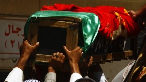 Mourners carry the coffin of victim killed by a car bomb attack, during a funeral in Najaf, 100 miles (160 kilometers) south of Baghdad, on August 11, 2013. (REUTERS/Haider Ala)