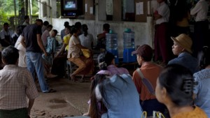 In this Aug 21, 2013 photo, Myanmar people gather to receive treatments at a clinic for HIV and Tuberculosis patients run by Médecins Sans Frontières, a medical non-profit, in the suburbs of Yangon, Myanmar. (AP Photo/Gemunu Amarasinghe)
