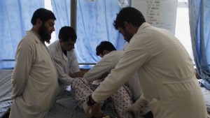 An Afghan man receives treatment at a hospital after a suicide bomb explosion in Kandahar province, southwest of Kabul, Afghanistan, on Saturday, August 31, 2013. (AP Photo/Allauddin Khan)