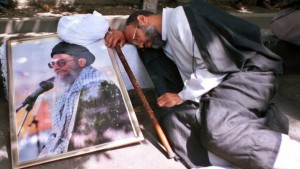 In this Tuesday, August 8, 2000, file photo, Iranian clergyman Mohammad Azadparvar, who allegedly was injured by chemical weapons in the 1980–1988 Iran–Iraq War, rests next to a picture of the supreme leader Ayatollah Ali Khamenei at a demonstration in front of Iranian parliament in support of the supreme leader Ayatollah Ali Khamenei. For more than a generation, Iranian newspapers regularly post notices: Another veteran of the 1980s war with Iraq has died of complications from exposure to chemical weapons from Saddam Hussein's arsenal. The claims now that Iran's Syrian allies used similar battlefield tactics, including possibly unleashing sarin gas, forced Tehran's leaders into perhaps their most difficult juncture of the nearly 30-month Syrian civil war: How much to stick by Bashar Assad if the Western allegations are backed by U.N. inspection teams. (AP photo/Vahid Salemi)