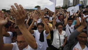 Demonstrators chant slogans during a protest against official corruption at Luneta Park in Metro Manila on August 26, 2013, to demand the abolition of a misused fund for legislators' pet projects. (REUTERS/Erik De Castro)