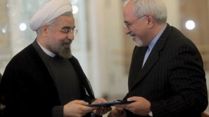 A handout picture released by the Iranian president's official website shows Iranian president Hassan Rouhani (L) handing over the decree to newly appointed foreign minister Mohammad Javad Zarif (R) during the handing over ceremony at the Foreign Ministry in Tehran on August 17, 2013. (AFP PHOTO/HO/PRESIDENT.IR)