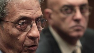 Amr Moussa (L), chairman of the committee to amend the country's constitution speaks at a news conference, next to media spokesperson Mohamed Salmawy, at the Shura Council in Cairo on September 22, 2013. (REUTERS/Mohamed Abd El Ghany)