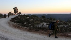 ISRAEL OUT Israeli soldiers are seen near an Iron Dome battery near Jerusalem, om Sunday, Sept. 8, 2013. (AP Photo/Gil Yohanan)