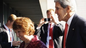 US secretary of state John Kerry, right, and European Union foreign policy chief Catherine Ashton walk after arriving for an informal meeting of EU ministers for Foreign Affairs at the National Art Gallery in Vilnius, Lithuania, on Saturday, September 7, 2013. (AP Photo/Mindaugas Kulbis)
