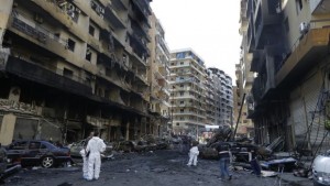 Lebanese Army investigators inspect at the site of a car bomb explosion in Dahieh, a southern suburb of Beirut, Lebanon, on Friday, August 16, 2013. (AP Photo/Hussein Malla)