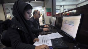In this Sunday, Januart 6, 2013, file photo, Iranians surf the web in an Internet cafe at a shopping center in central Tehran, Iran. (AP Photo/Vahid Salemi, File)