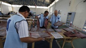 Employees of the Independent High Electoral Commission (IHEC) take part in vote counting at an analysis centre in Erbil, capital of the autonomous Kurdistan region, about 230 miles north of Baghdad, on September 22, 2013. (REUTERS/Thaier Al-Sudani)