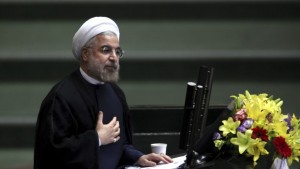 In this Thursday, August 15, 2013 file photo, Iranian president Hassan Rouhani speaks during the debate on the proposed Cabinet at the parliament in Tehran, Iran. (AP Photo/Ebrahim Noroozi, File)