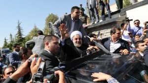 Iranian president Hassan Rouhani waves to supporters as his motorcade leaves Tehran's Mehrabad Airport upon his arrival from New York on September 28, 2013.(AFP PHOTO/ATTA KENARE)