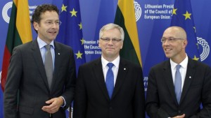 Lithuania's Minister of Finance Rimantas Sadzius, center,talks with president of the Eurogroup Jeroen Dijsselbloem, left, and European Central Bank Member of the Executive Board Joerg Asmussen, right, prior to the Informal Meeting of Ministers for Economic and Financial Affairs (ECOFIN) in the National Art Gallery in Vilnius, Lithuania, on Friday, September 13, 2013. (AP Photo/Mindaugas Kulbis)
