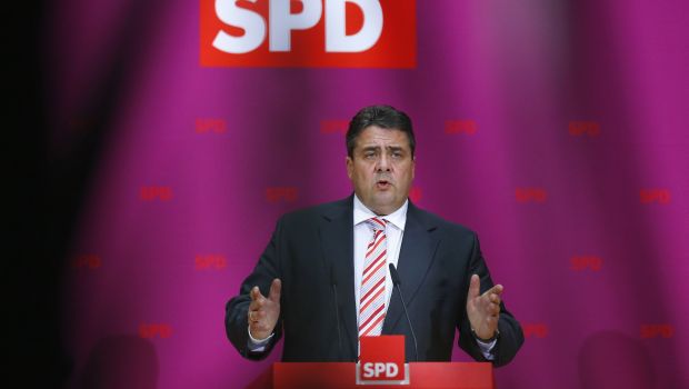Germany’s SPD backs coalition talks with Merkel, sets terms