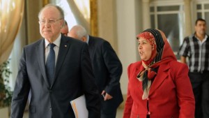 Tunisian Constituent Assembly president Mustapha Ben Jaafar arrives with his vice president, Mahrezia Laabidi, to a meeting as part of the dialogue between the ruling Islamists and the opposition aimed at ending a two-month political crisis, on October 26, 2013, in Tunis. (AFP PHOTO/FETHI BELAID)