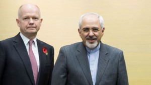 British Foreign Secretary William Hague (L) and Iranian Foreign Minister Mohammad Javad Zarif attend the third day of closed-door nuclear talks at the Intercontinental Hotel in Geneva November 9, 2013. (REUTERS/Jean-Christophe Bott/Pool)