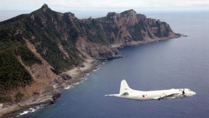 This photo taken on October 13, 2011 shows a P-3C patrol plane of Japanese Maritime Self-Defense Force flying over the disputed islets known as the Senkaku islands in Japan and Diaoyu islands in China, in the East China Sea (AFP PHOTO / JAPAN POOL via JIJI PRESS JAPAN OUT)