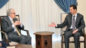 In this photo released by the Syrian official news agency SANA, Syrian president Bashar Al-Assad, right, speaks with the UN–Arab League envoy for Syria, Lakhdar Brahimi, in Damascus, Syria, on Wednesday, October 30, 2013. (AP Photo/SANA)