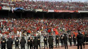 In this Sunday, November 4, 2012, file photo, Egyptian riot police stand guard at the Burg El-Arab Stadium stadium near Alexandria, Egypt, before Egypt's Al-Ahly club takes on Tunisia's Esperance. (AP Photo/Mohammed Asad, File)