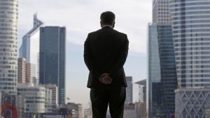 File photograph shows a businessman silhouetted as he stands under the Arche de la Défense in the financial district west of Paris on November 20, 2012. (REUTERS/Christian Hartmann/Files)
