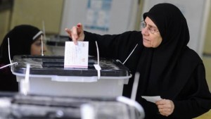 A woman casts her vote at a polling station during a referendum on Egypt's new constitution in Cairo on January 14, 2014. (Reuters/Mohamed Abd El Ghany)