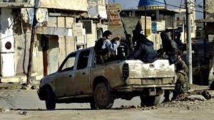 This undated image posted on a militant website on Tuesday, January 14, 2014, shows fighters from the Al-Qaida-affiliated Islamic State of Iraq and Syria (ISIS) marching in Raqqa, Syria. (AP Photo/militant website)