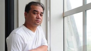 In this file picture taken on June 12, 2010, University professor, blogger, and member of the Muslim Uighur minority, Ilham Tohti, pauses before a classroom lecture in Beijing. (AFP Photo/Files/Frederic J. brown)