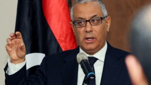 Libyan Prime Minister Ali Zeidan speaks during a press conference on January 22, 2014 in the capital Tripoli. Zeidan vowed on January 21 to stay at his post, as Islamist ministers quit in protest at persistent lawlessness that saw him briefly abducted last year. AFP PHOTO / MAHMUD TURKIA