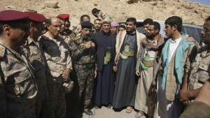 Abdul-Qader Hilal, center, mayor of the Yemeni capital Sanaa, stands with military officials and tribesmen during a mediation between Shi'ite Muslim rebels and Sunni tribesmen in the northern province of Amran, on February 4, 2014. (Reuters/Yemen's Defense Ministry/Handout via Reuters)