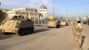 A convoy of Iraqi security forces' armored vehicles moves along during clashes with Al-Qaeda-affiliated Islamic State in Iraq and Syria (ISIS) in Anbar province, Iraq, on February 1, 2014. (Reuters/Stringer)