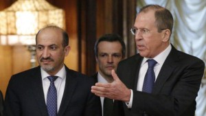 Russian Foreign Minister Sergey Lavrov, right, welcomes Ahmad Al-Jarba, left, who heads a delegation of the Syrian National Coalition prior to talks in Moscow on Tuesday, February 4, 2014. (AP Photo/Alexander Zemlianichenko)
