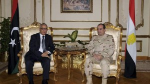 Egypt's Army Chief Field Marshal Abdel-Fattah El-Sisi, right, meets with Libya's Prime Minister Ali Zeidan at the Ministry of Defense headquarters in Cairo in this February 1, 2014 picture provided by Egypt's Ministry of Defense. (Reuters/Egypt's Ministry of Defense/Handout via Reuters)