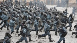 A file picture dated January 22, 2014 shows members of the Ukrainian riot police unit, the Berkut, attacking protesters during an anti-government protest in downtown Kiev. (EPA/Alexei Furman)
