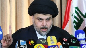 Iraqi Shiite cleric Moqtada al-Sadr delivers a speech from the southern Iraqi city of Najaf on February 18, 2014. Al-Sadr slammed Iraq's government as corrupt and headed by a "dictator" while calling on citizens to vote, just days after announcing his exit from politics AFP PHOTO/HAIDAR HAMDANI