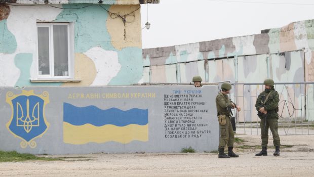 Putin: Troops to bases; warning shots in Crimea