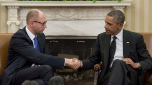 US President Barack Obama and Ukrainian Prime Minister Arseny Yatseniuk shake hands during meetings in the Oval Office of the White House in Washington, DC, on March 12, 2014. (AFP Photo/Saul Loeb)