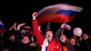 People react after the end of a referendum in Sevastopol, in the Crimea region in Ukraine, on March 16, 2014. (EPA/Zurab Kurtsikidze)