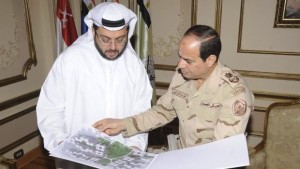 Egypt's army chief Field Marshal Abdel-Fattah El-Sisi, right, looks at drawings of houses with Hassan Ismaik, Arabtec's chief executive, at the Ministry of Defense in Cairo in this March 9, 2014 handout provided by Egypt's Ministry of Defense.( Reuters/Ministry of Defence/Handout via Reuters)