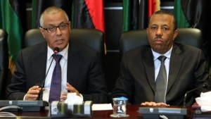 A file photo dated November 16, 2013 shows Libyan Prime Minister Ali Zeidan, left, and Libyan Minister of Defense Abdallah Al-Thani attending a press conference with members of the government, in Tripoli, Libya. (EPA/Sabri Elmhedwi)