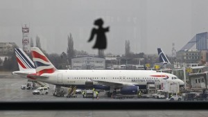 A British Airways airplane waits on the tarmac for a flight to Heathrow airport in Britain on January 1, 2014. (REUTERS/Bogdan Cristel)