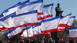 People attend a rally in front of Crimean flags at Lenin Square in Simferopol, Crimea, Ukraine, on March 15, 2014. (EPA/YURI KOCHETKOV)