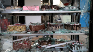 Cakes are seen inside a broken refrigerator in a patisserie shop, damaged by a deadly car bomb that exploded in early February in the predominately Shi'ite town of Hermel, about 10 miles (16 kilometers) from the Syrian border in northeast Lebanon. (AP Photo/Hussein Malla)