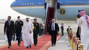 US President Barack Obama (L) is welcomed by Prince Khaled Bin Bandar Bin Abdul Aziz, Emir of Riyadh (3rdL), upon his arrival at King Khalid International Airport in Riyadh, Saudi Arabia, on March 28, 2014. Obama arrived in Riyadh for talks with Saudi King Abdullah as mistrust fuelled by differences over Iran and Syria overshadows a decades-long alliance between their countries. AFP PHOTO / SAUL LOEB