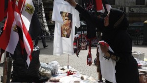 A vendor hangs a T-shirt with a picture of Field Marshal Abdel Fattah al-Sisi on a tree in Tahrir square in Cairo February 22, 2014. REUTERS/Asmaa Waguih