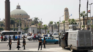 Egyptian police deploy outside of Cairo University a day after a series of three bombs went off in Giza, Egypt, on Thursday, April 3, 2014. (AP Photo/Ahmed Abdel Fattah, El Shorouk)