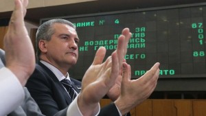 Crimea's Prime Minister Sergei Aksyonov reacts after the constitution of Crimea was approved during a session of the State Council of the Republic of Crimea in Simferopol on April 11, 2014. (REUTERS/Maxim Shemetov)